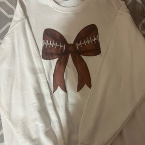 White Sweater with Football Bow Design